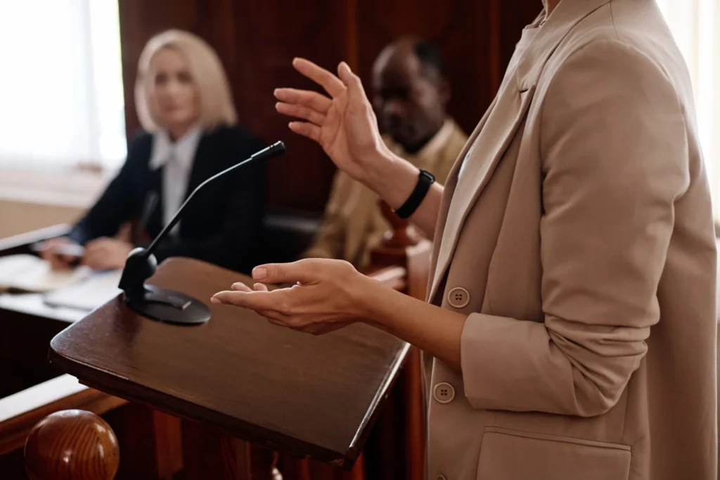 cropped photo of witness testifying in court