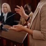cropped photo of witness testifying in court