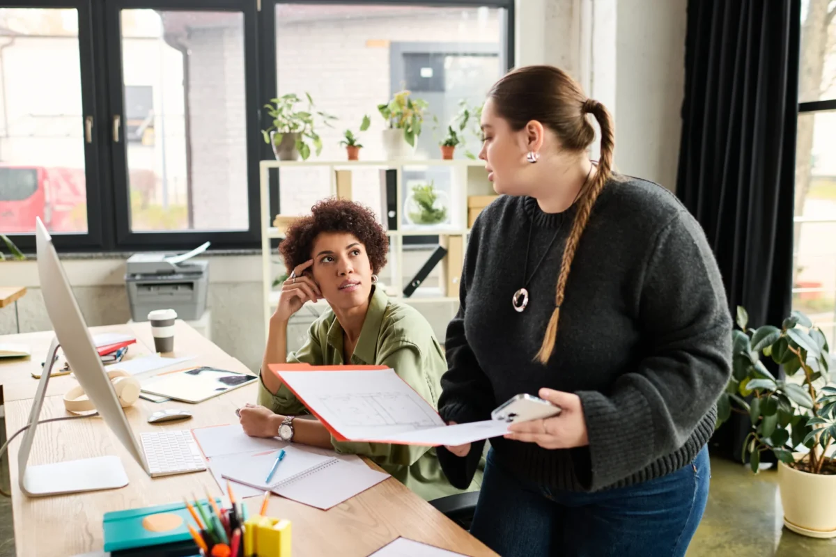 women working together talking about a case file