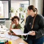 women working together talking about a case file